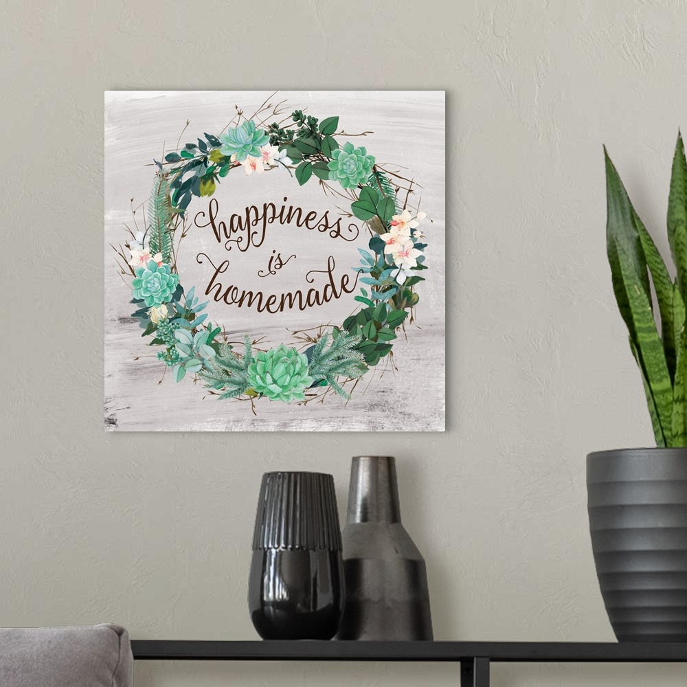 A modern room featuring A wreath of succulents, various flowers and foliage surround the words, "Happiness is Homemade".