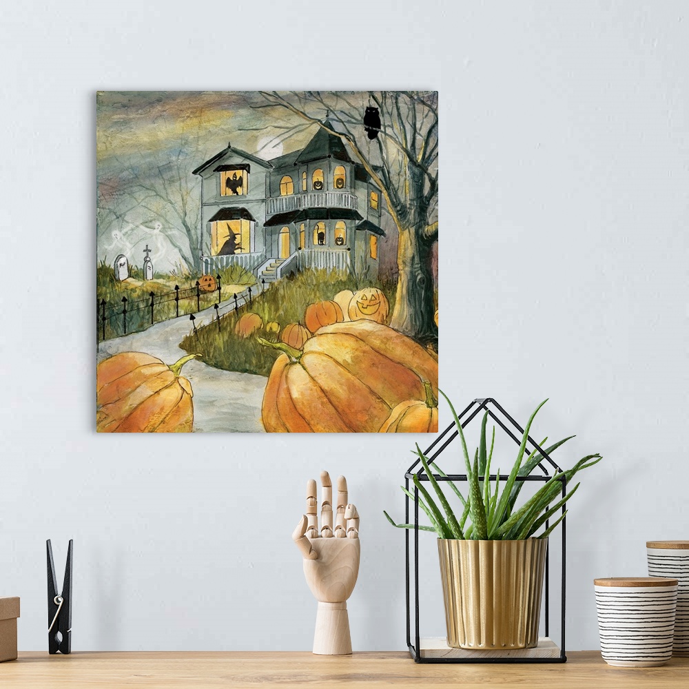 A bohemian room featuring A spooky haunted house with figures in the windows surrounded by pumpkins.