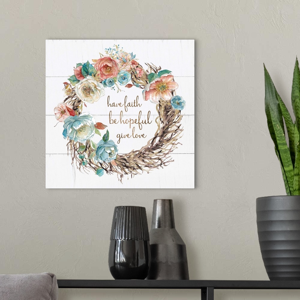 A modern room featuring A wreath of watercolor flowers and branches surround the hand lettering sentiment, "Have faith, b...