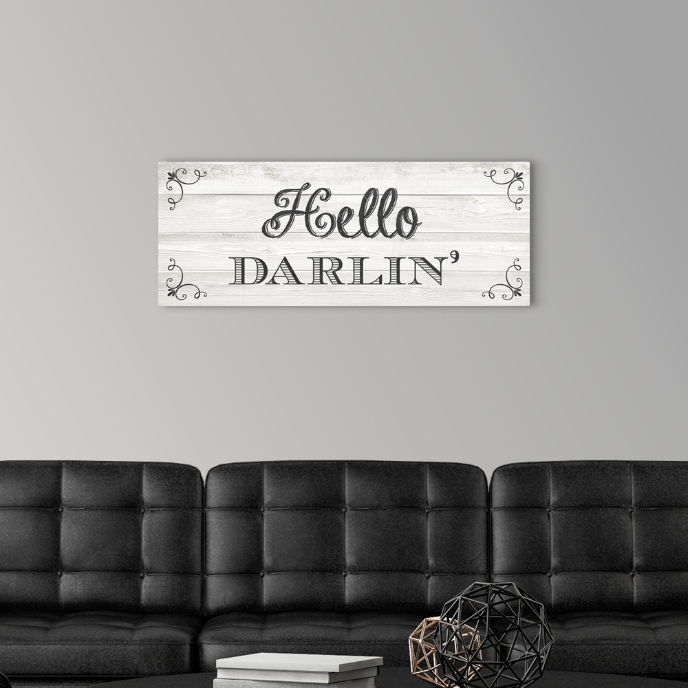 A modern room featuring The southern sentiment "Hello darlin'" is black text placed on a faux wood texture adorned with e...