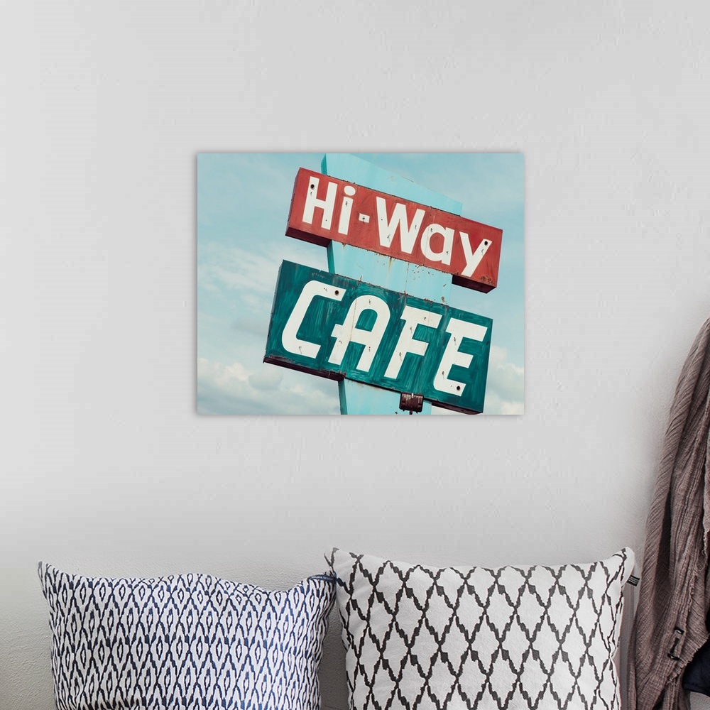 A bohemian room featuring Photograph of a retro blue and red 'Hi-Way Cafe' sign with a blue sky background.