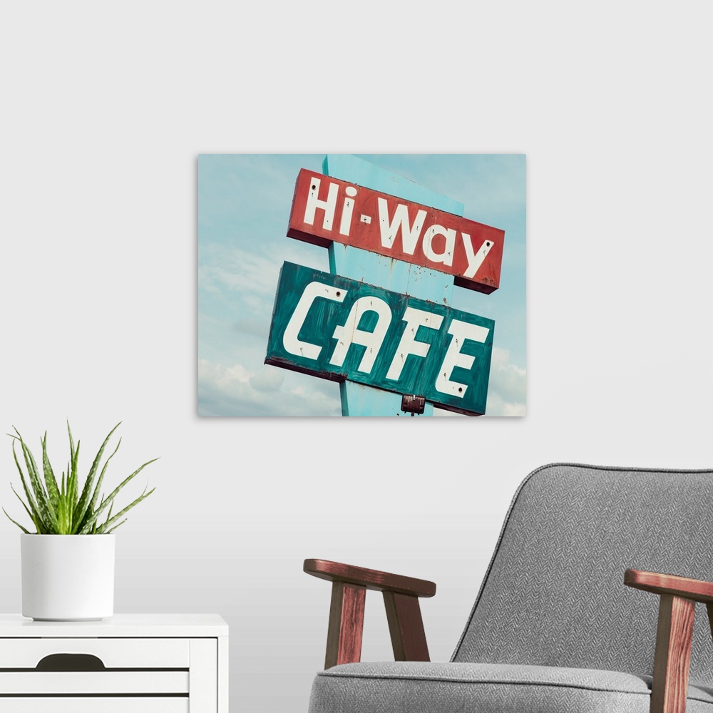 A modern room featuring Photograph of a retro blue and red 'Hi-Way Cafe' sign with a blue sky background.