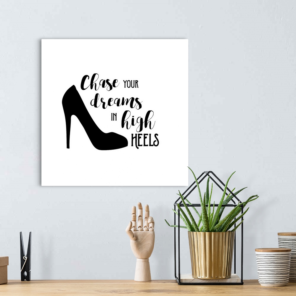 A bohemian room featuring Decorative artwork with the text "Chase Your Dreams in High Heels" with a shoe.