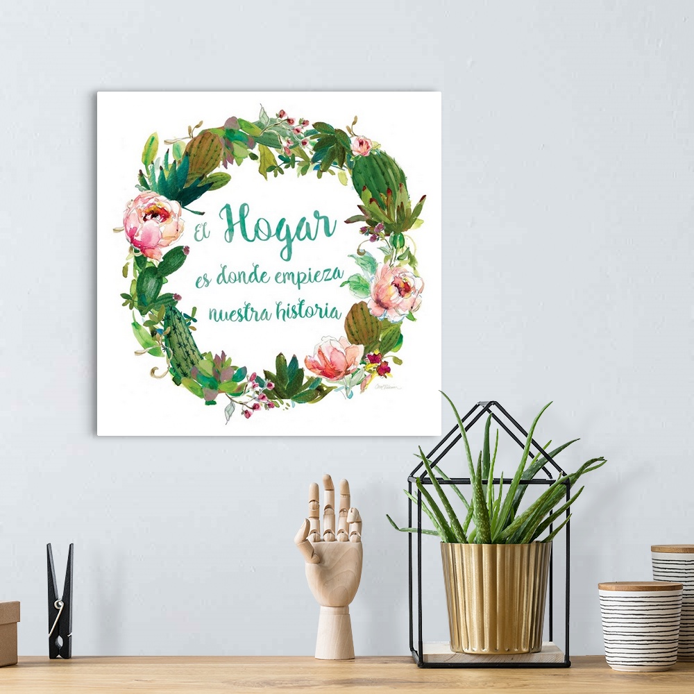 A bohemian room featuring A wreath of cacti, various flowers and foliage surround the words, "El hogar es donde empieza nue...