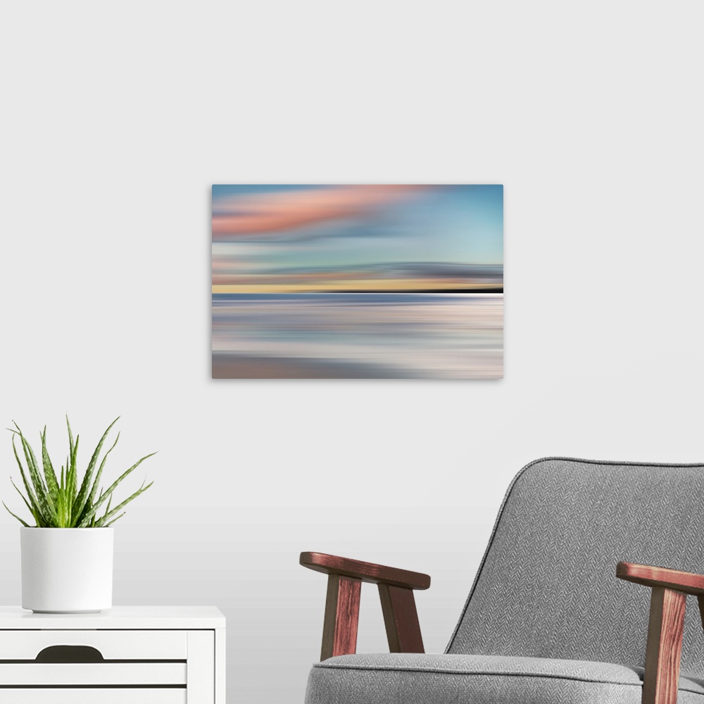A modern room featuring Abstract photograph of a colorful landscape made with horizontal movement and pastel colors.