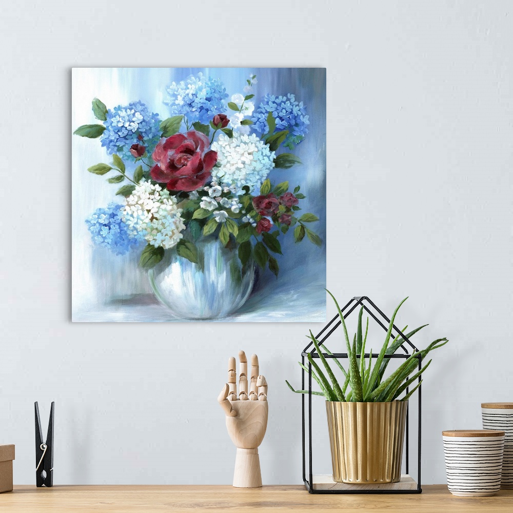 A bohemian room featuring Square still life painting of a floral arrangement with blue tones.