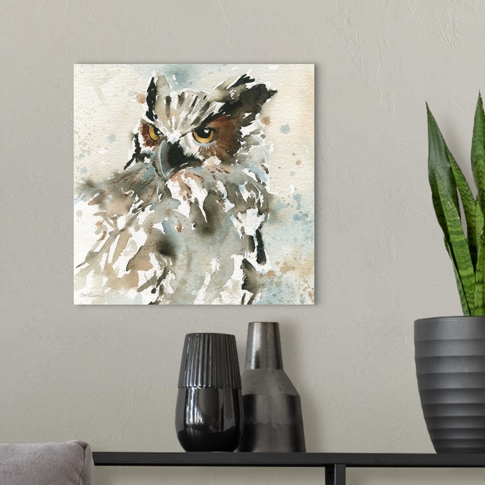 A modern room featuring A watercolor painting of an abstract owl with a neutral background that has paint splattered on it.