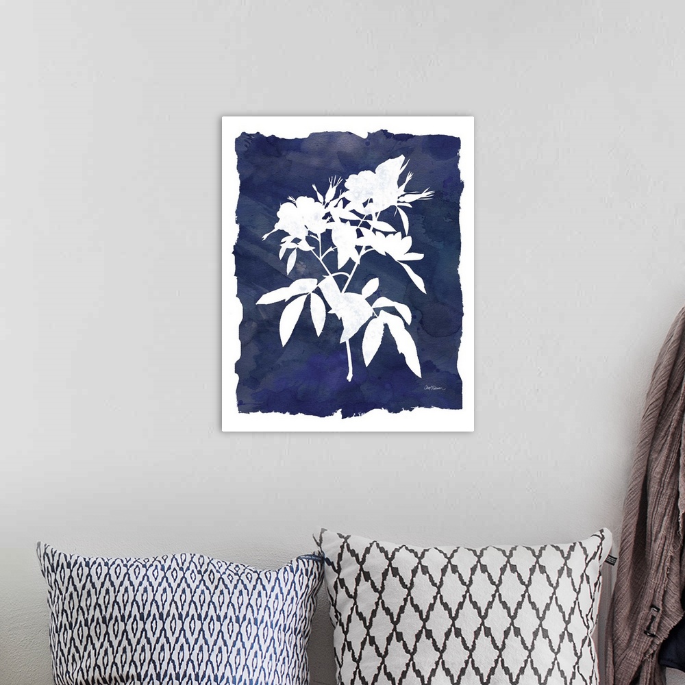 A bohemian room featuring Cyanotype with white silhouetted flowers on an indigo background with a white boarder.
