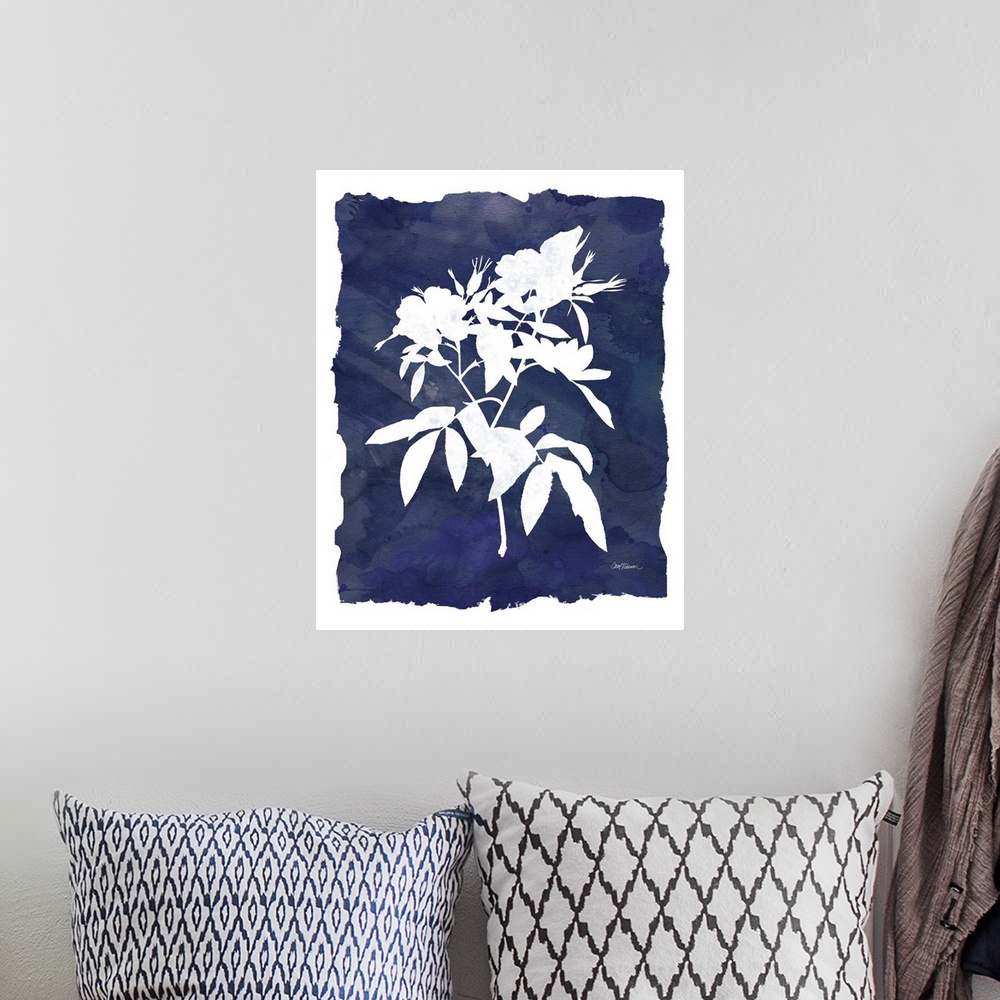 A bohemian room featuring Cyanotype with white silhouetted flowers on an indigo background with a white boarder.