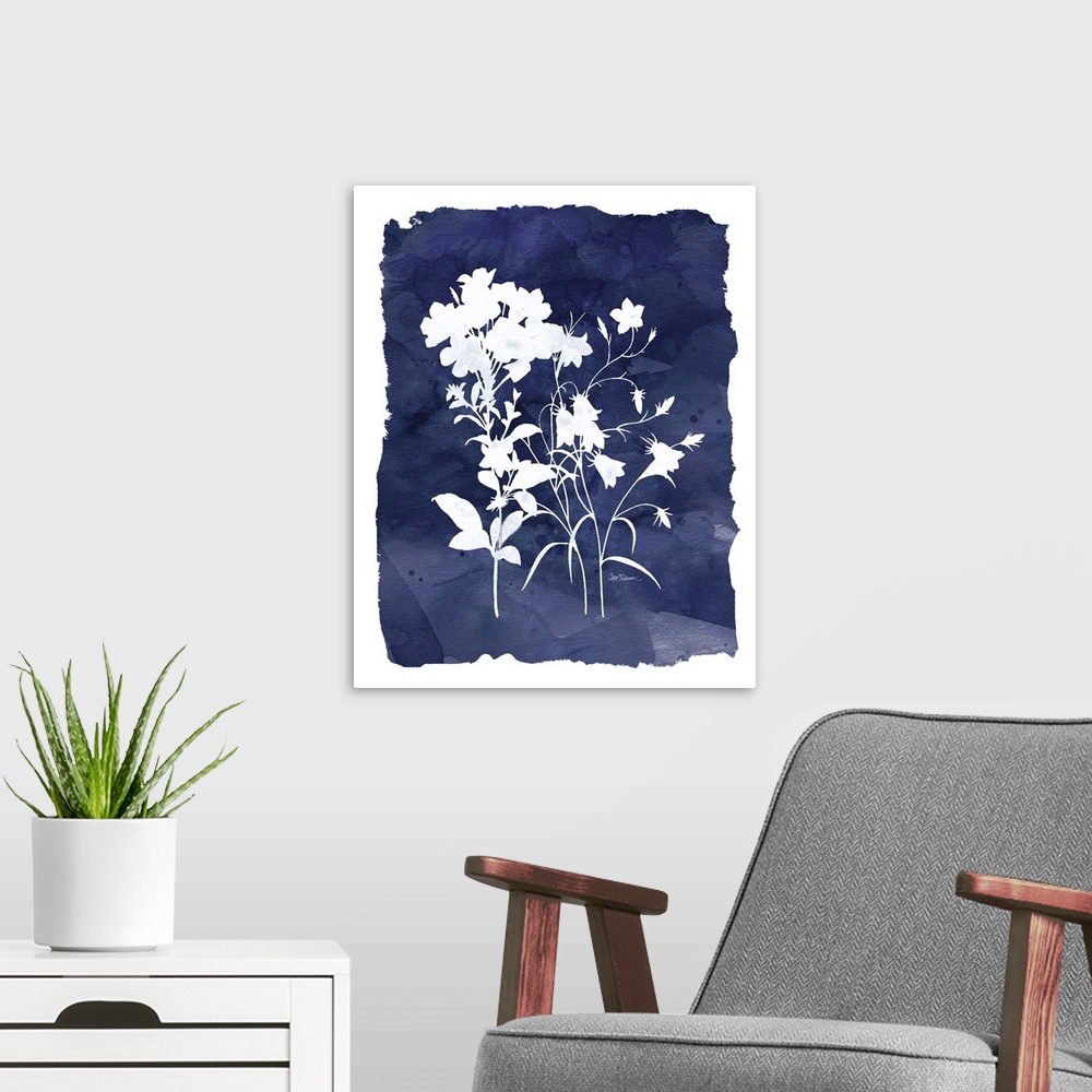A modern room featuring Cyanotype with white silhouetted flowers on an indigo background with a white boarder.