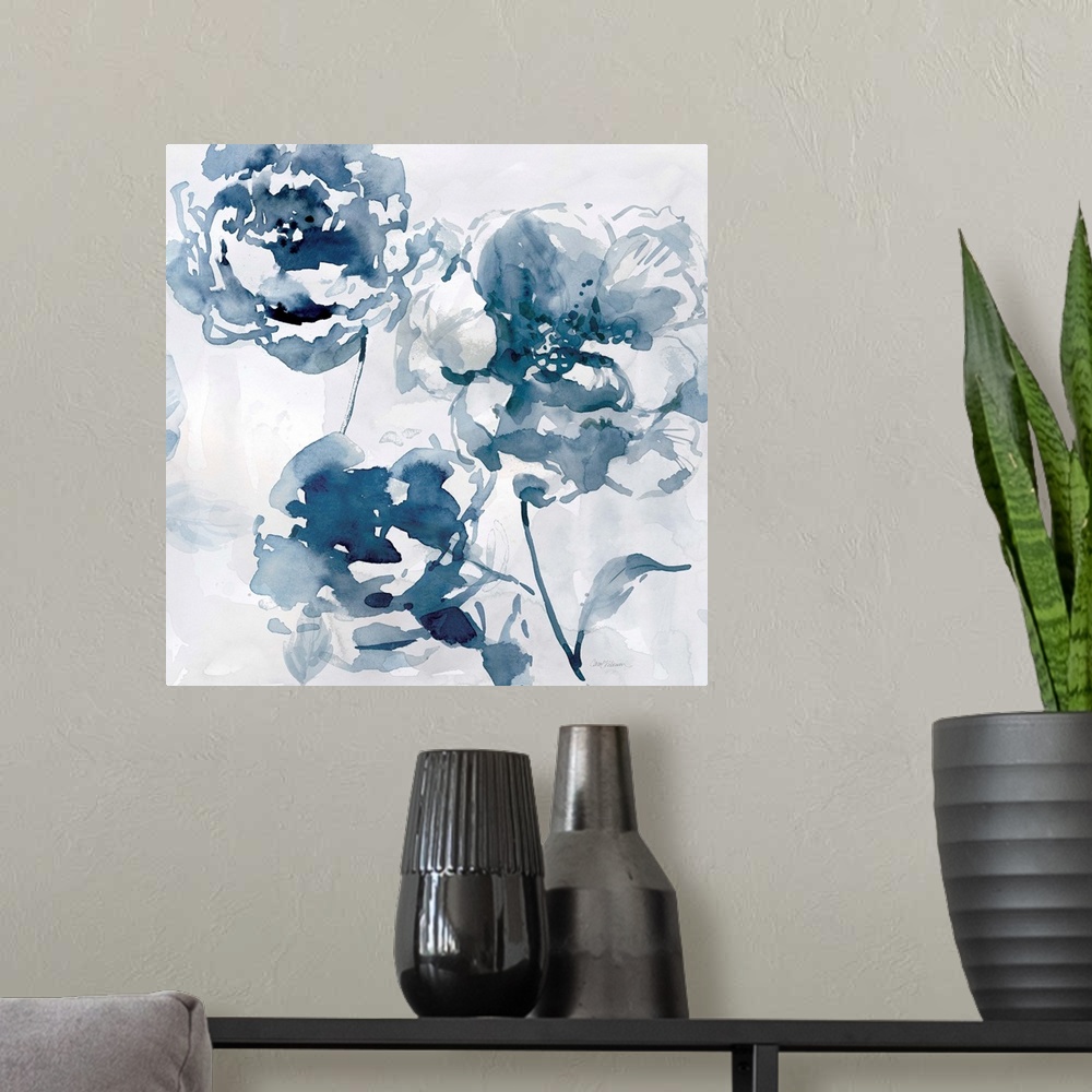 A modern room featuring A square abstract watercolor painting of blue flowers.