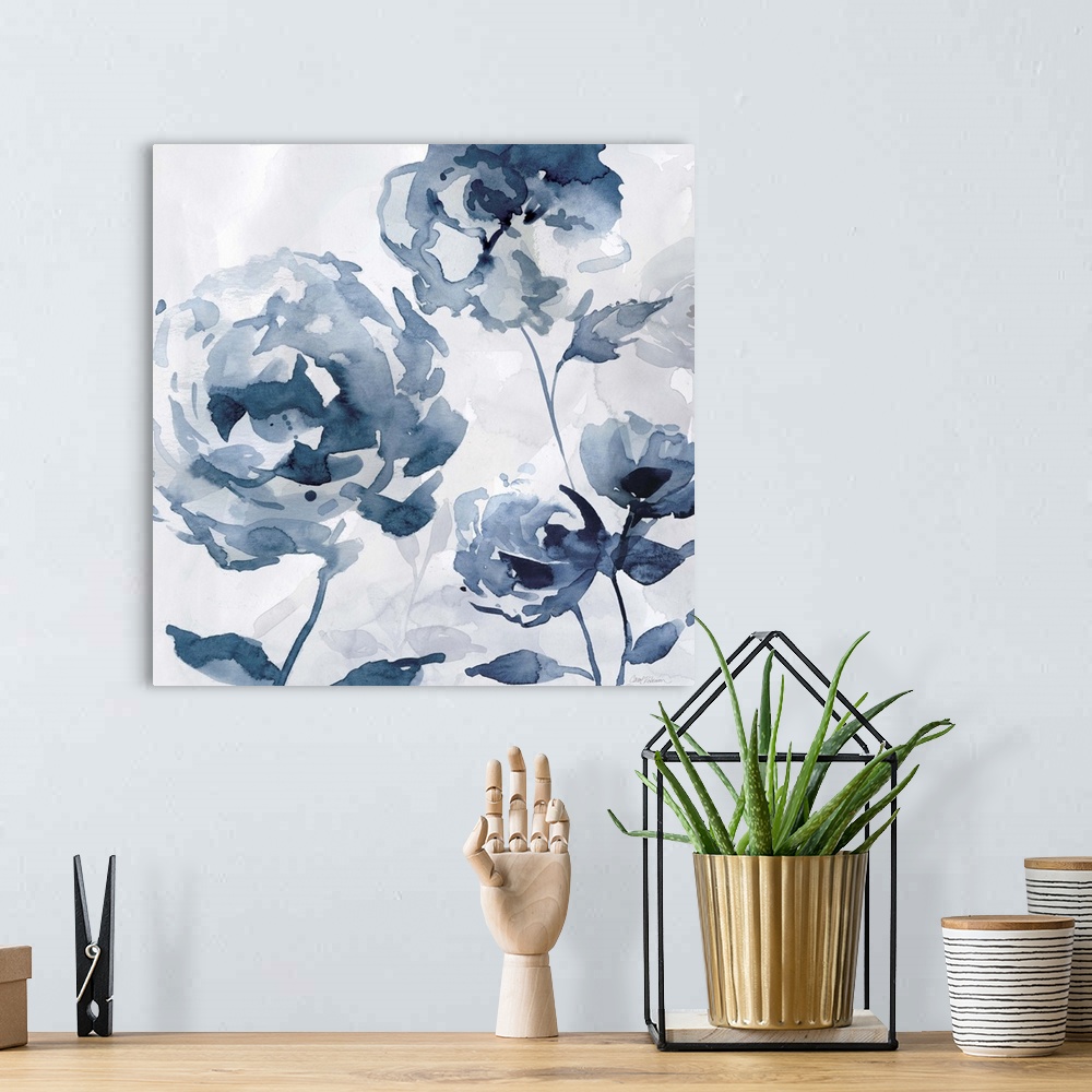 A bohemian room featuring A square abstract watercolor painting of blue flowers.