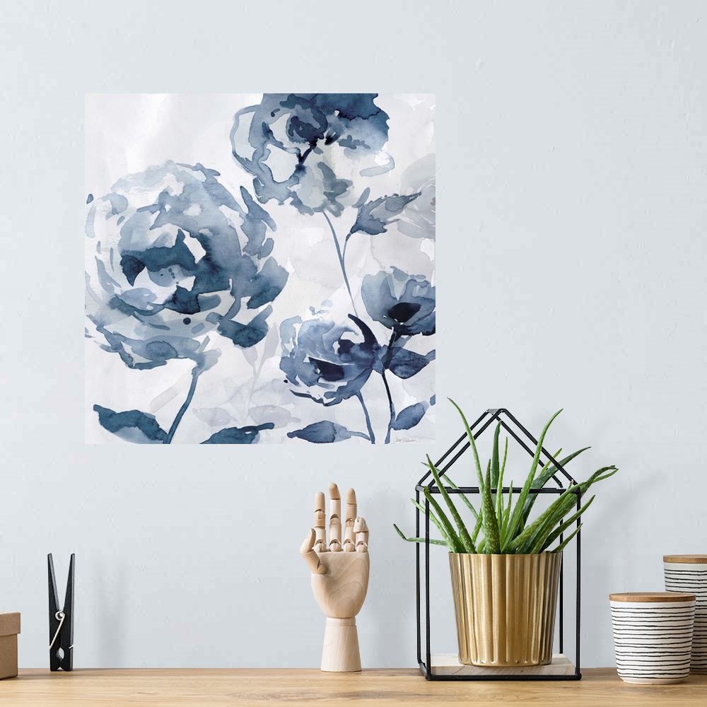 A bohemian room featuring A square abstract watercolor painting of blue flowers.