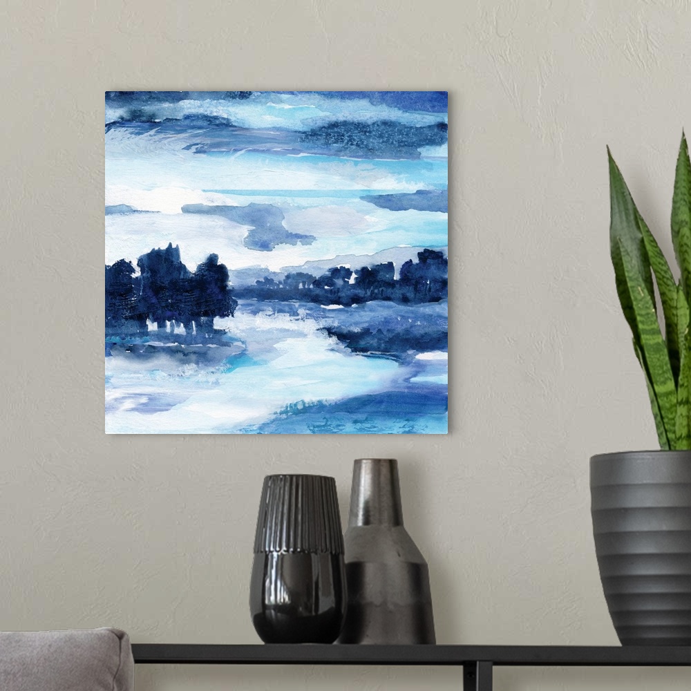 A modern room featuring Square watercolor landscape painting made with shades of blue.