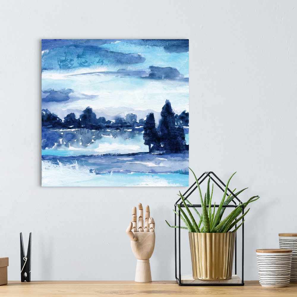 A bohemian room featuring Square watercolor landscape painting made with shades of blue.