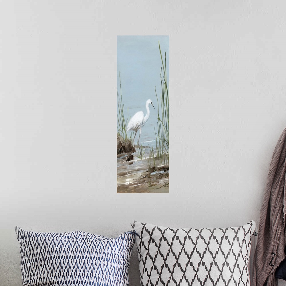 A bohemian room featuring Tall panel painting of an egret on a rocky shore with tall beach grass.