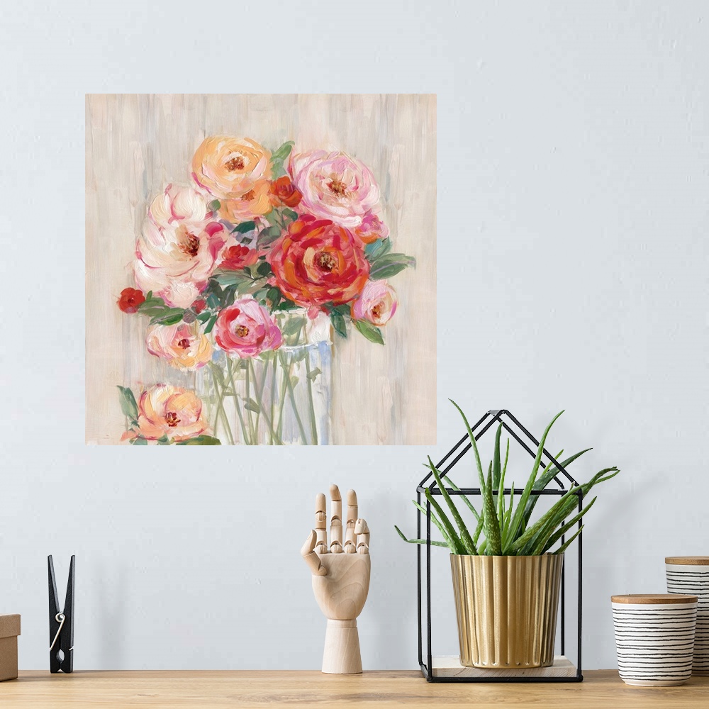 A bohemian room featuring Square painting of pink, orange, and red flowers neatly arranged in a glass vase on a neutral col...