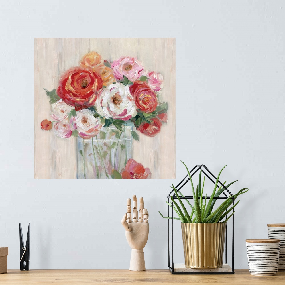 A bohemian room featuring Square painting of pink, orange, white, and red flowers neatly arranged in a glass vase on a neut...