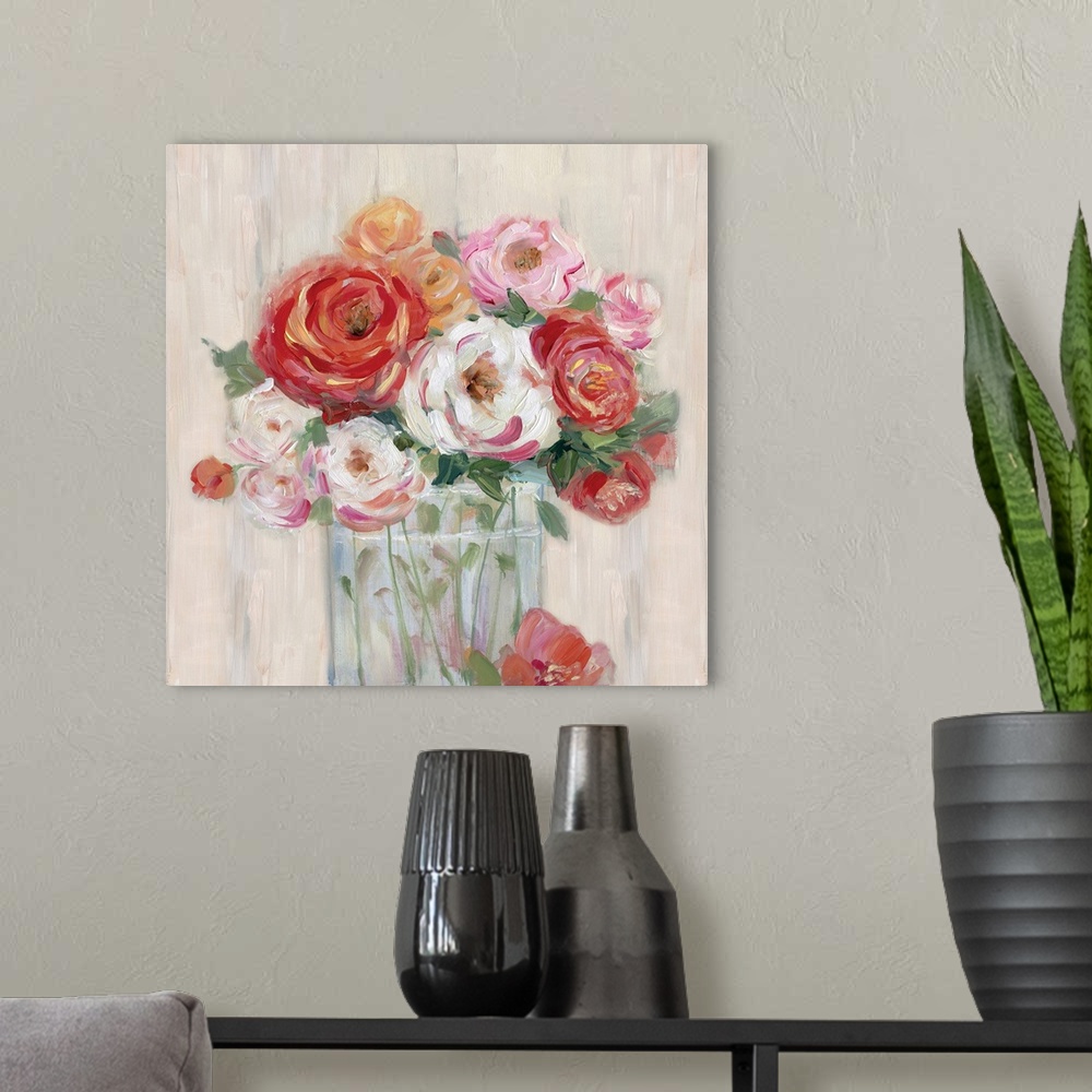 A modern room featuring Square painting of pink, orange, white, and red flowers neatly arranged in a glass vase on a neut...