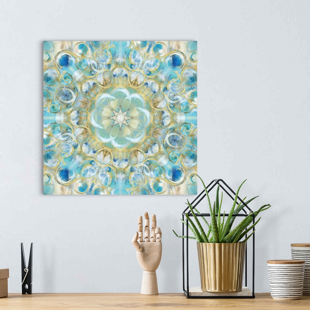 A bohemian room featuring Kaleidoscope art with circular shapes forming together in shades of blue, white, and gold on a sq...