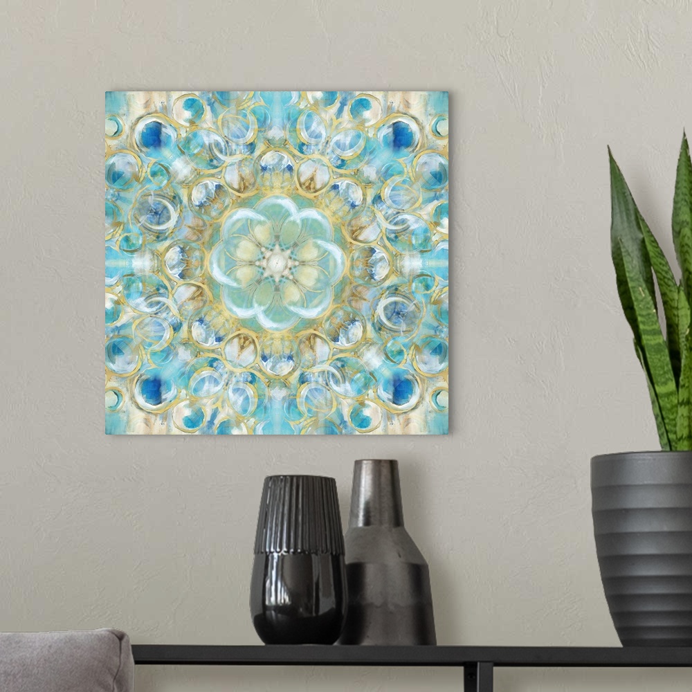 A modern room featuring Kaleidoscope art with circular shapes forming together in shades of blue, white, and gold on a sq...