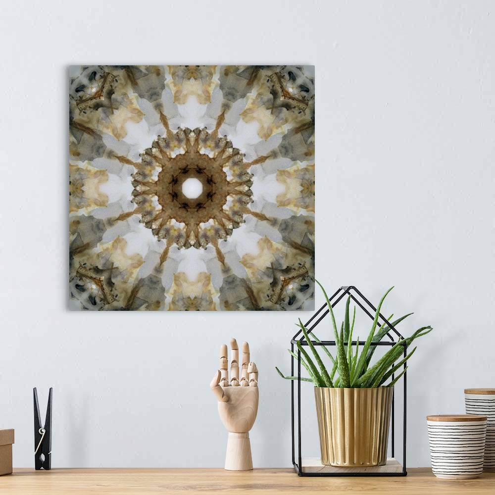 A bohemian room featuring Gold, gray, black, and white abstract decor resembling a view through a kaleidoscope