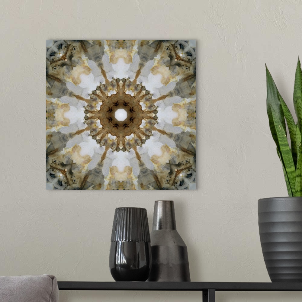 A modern room featuring Gold, gray, black, and white abstract decor resembling a view through a kaleidoscope