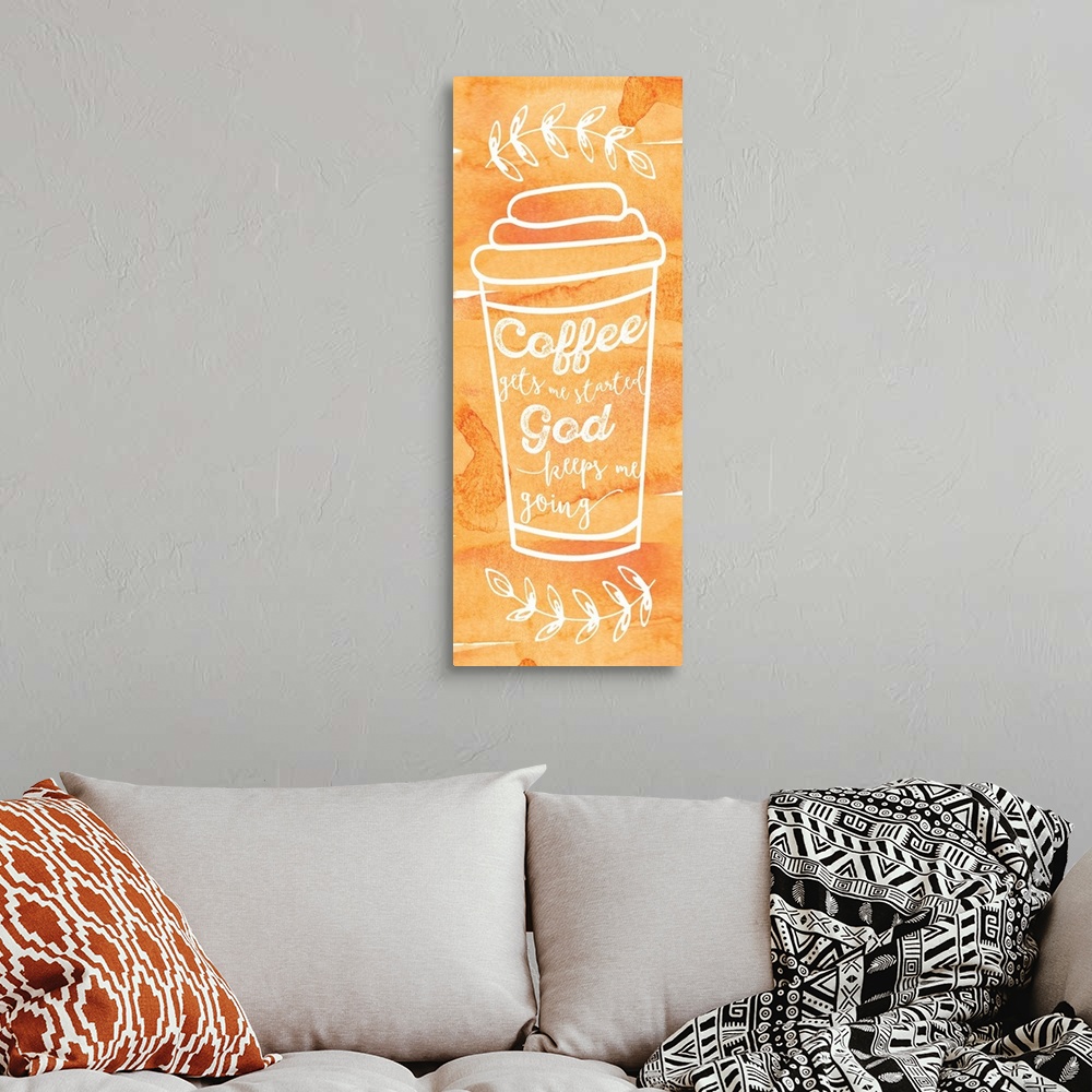 A bohemian room featuring Tall, orange sign with a white outline of a coffee cup and the phrase "Coffee Gets Me Started, Go...