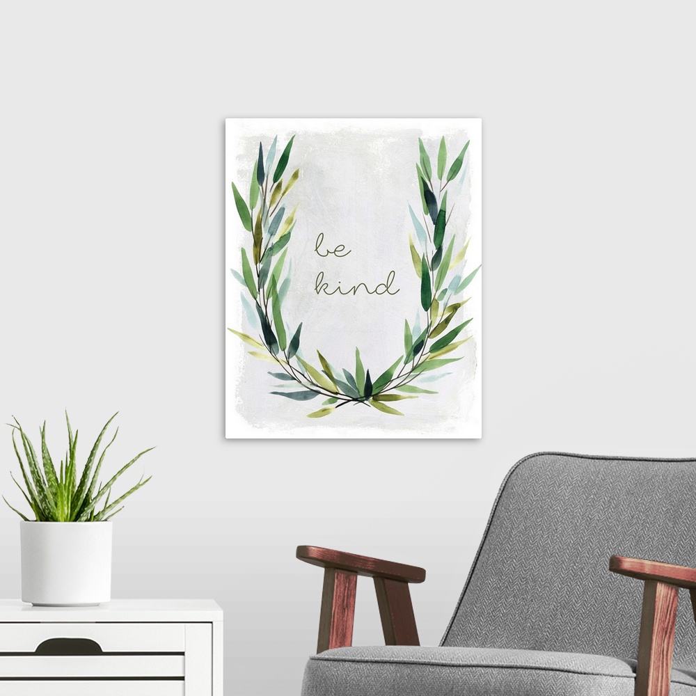 A modern room featuring "Be Kind" placed on a white textured background with leaves surrounding it.