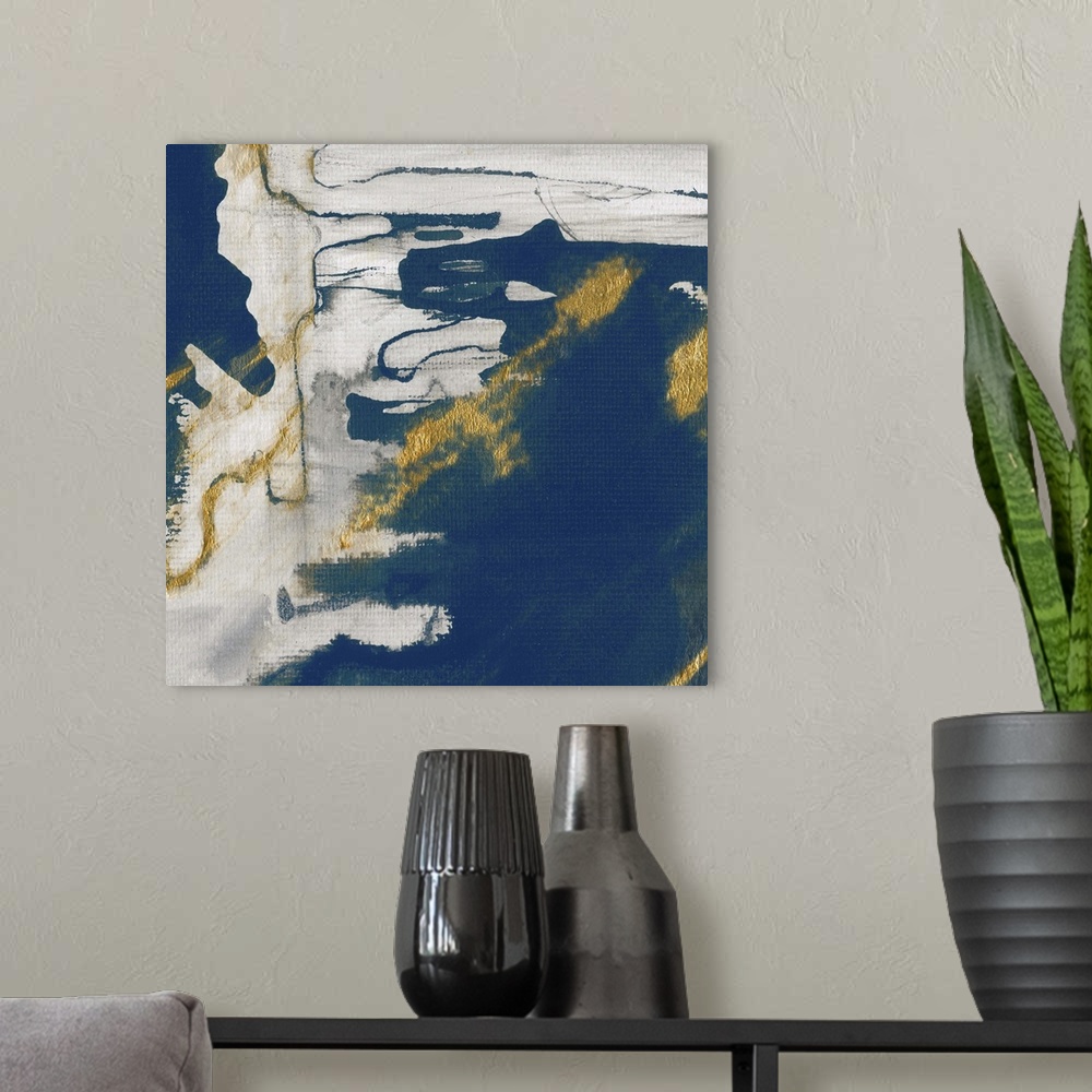 A modern room featuring Modern abstract artwork with shades of deep blue accented with gold.