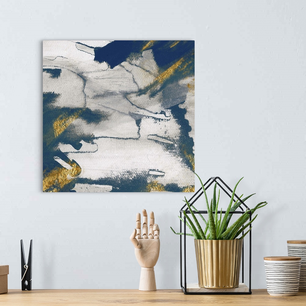 A bohemian room featuring Modern abstract artwork with shades of deep blue accented with gold.