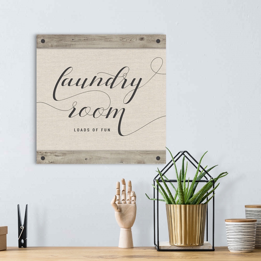 A bohemian room featuring Laundry Room 'Loads of Fun' neutral colored square sign.