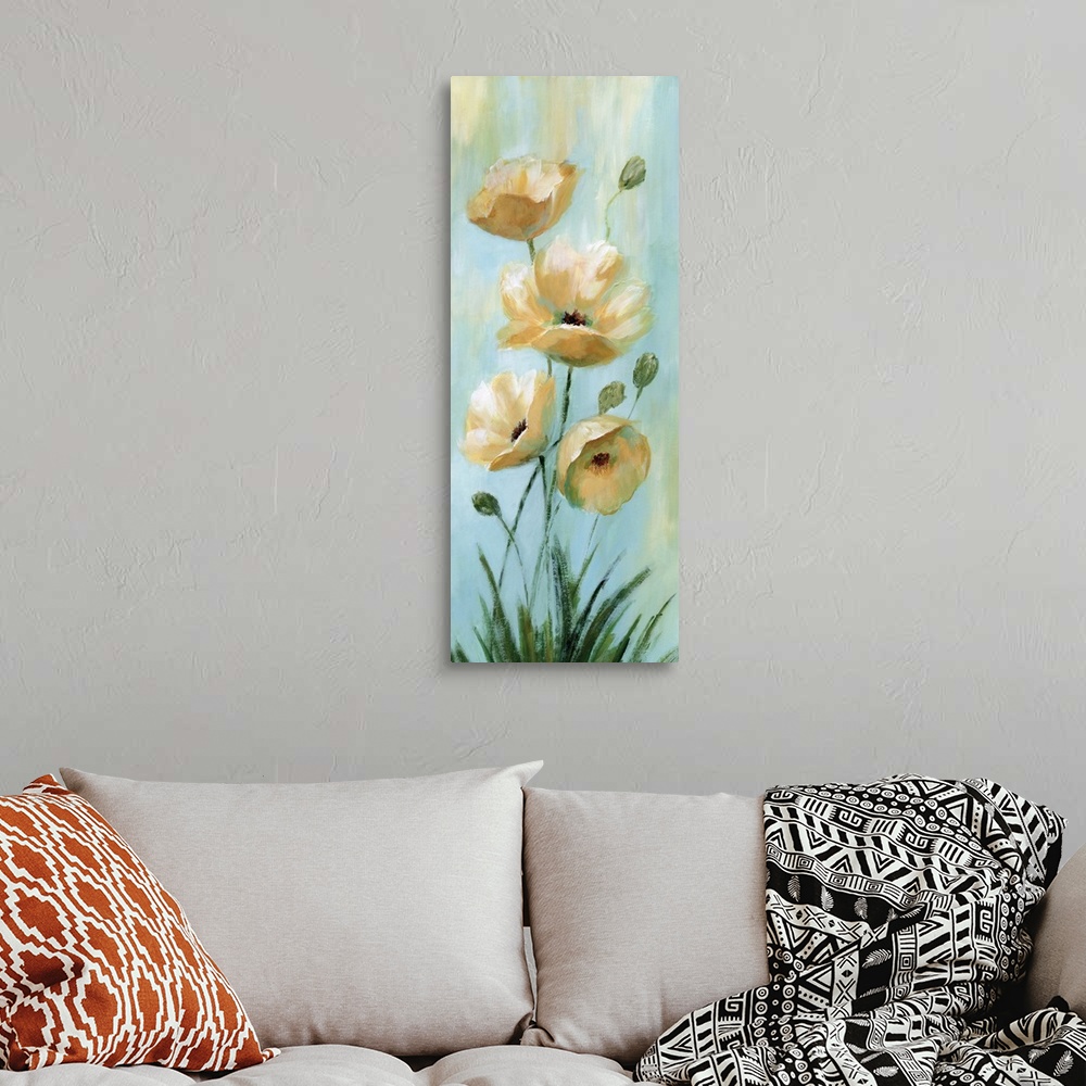 A bohemian room featuring Vertical painting of blooming yellow flowers against pale blue.