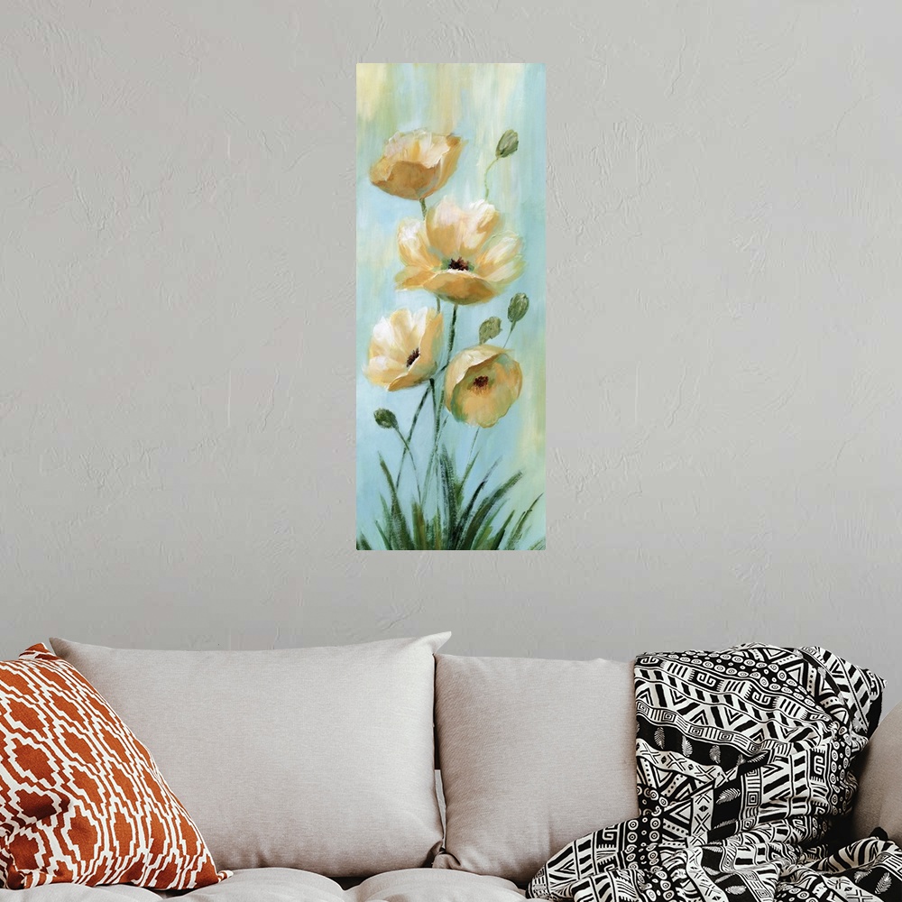 A bohemian room featuring Vertical painting of blooming yellow flowers against pale blue.