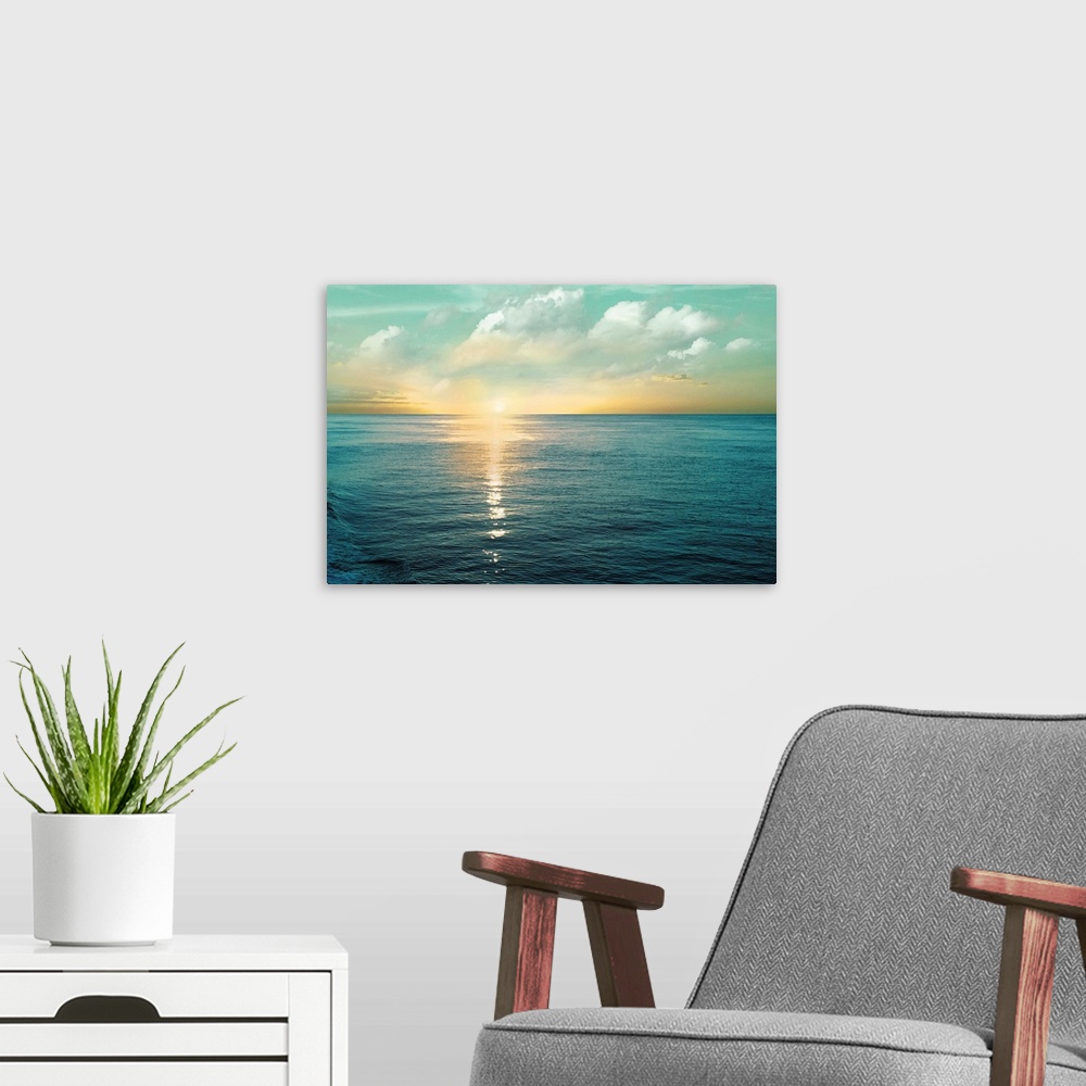 A modern room featuring A photo of a solace sunrise glimmering on the ocean as it ascends to the sky.