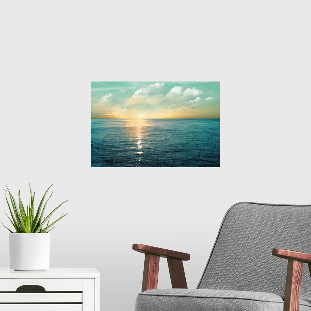 A modern room featuring A photo of a solace sunrise glimmering on the ocean as it ascends to the sky.