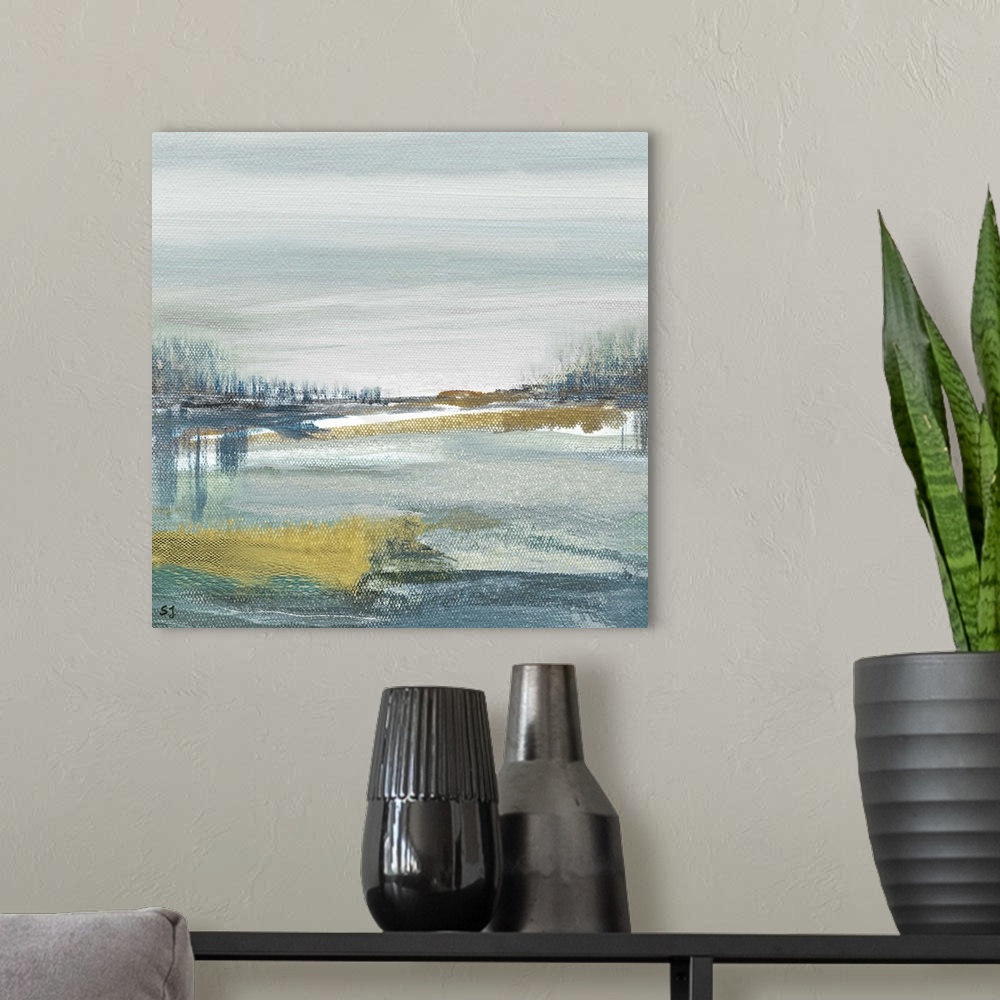 A modern room featuring Square painting of an abstract beach landscape in shades of blue, green, grey, and gold.