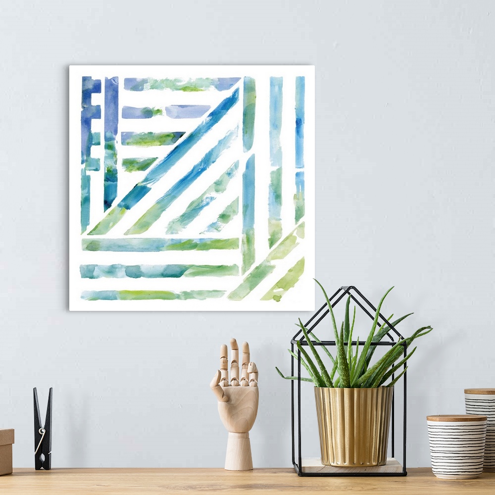 A bohemian room featuring A watercolor painting of a geometric lined design with cool colors representing a view through a ...