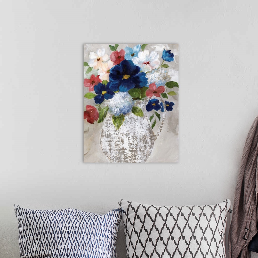 A bohemian room featuring Contemporary painting of a white linen textured vase filled with flowers of red, white and blue.