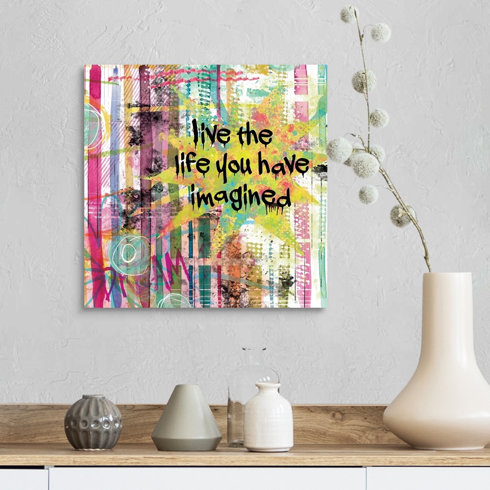 A farmhouse room featuring Inspirational square painting with colorful lines and designs and the phrases "Live the Life You ...