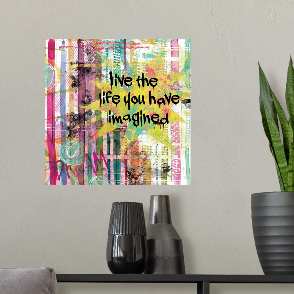 A modern room featuring Inspirational square painting with colorful lines and designs and the phrases "Live the Life You ...