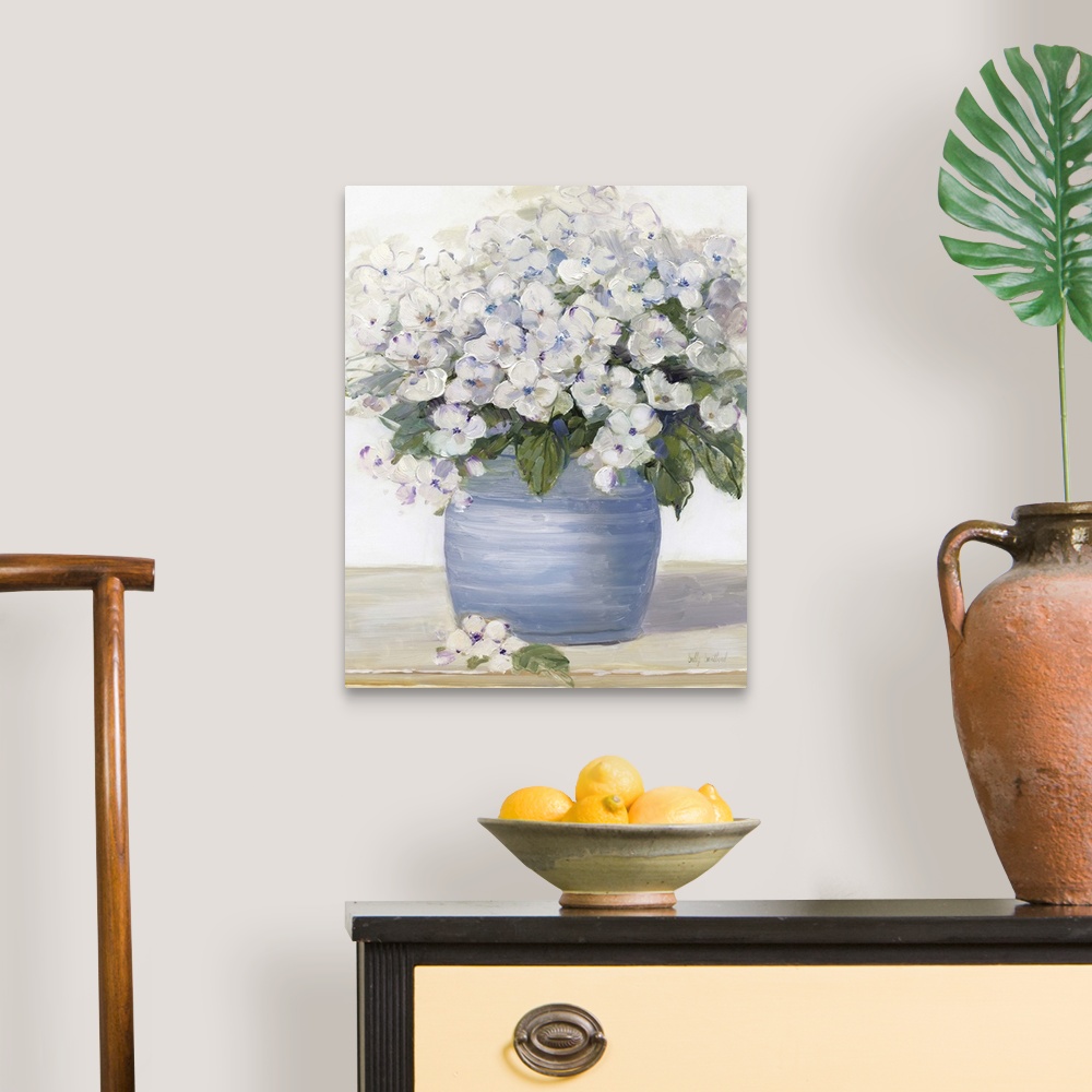 A traditional room featuring Large still life painting of arranged hydrangeas on a table.