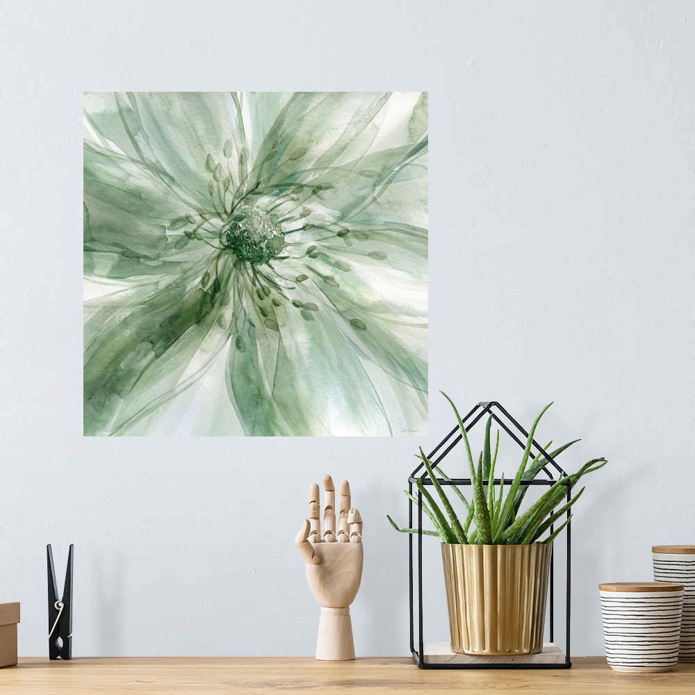 A bohemian room featuring Square watercolor painting of a large flower in shades of green taking up the whole frame.