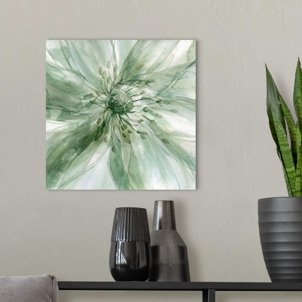 A modern room featuring Square watercolor painting of a large flower in shades of green taking up the whole frame.