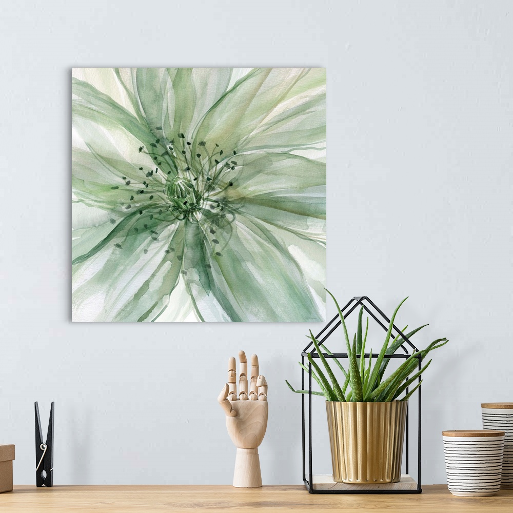 A bohemian room featuring Square watercolor painting of a large flower in shades of green taking up the whole frame.