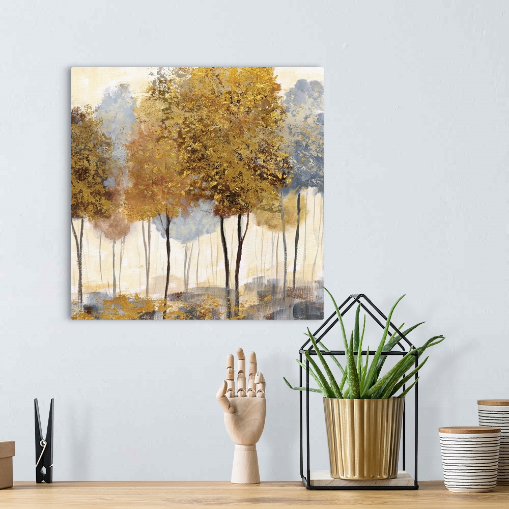 A bohemian room featuring Square decor with metallic gold and silver trees in an abstract forest.