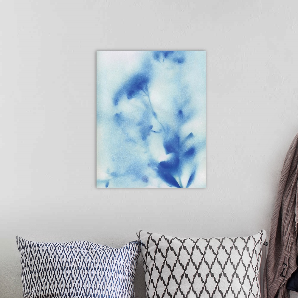 A bohemian room featuring Abstract painting of wildflowers with a misty look in blue and white.