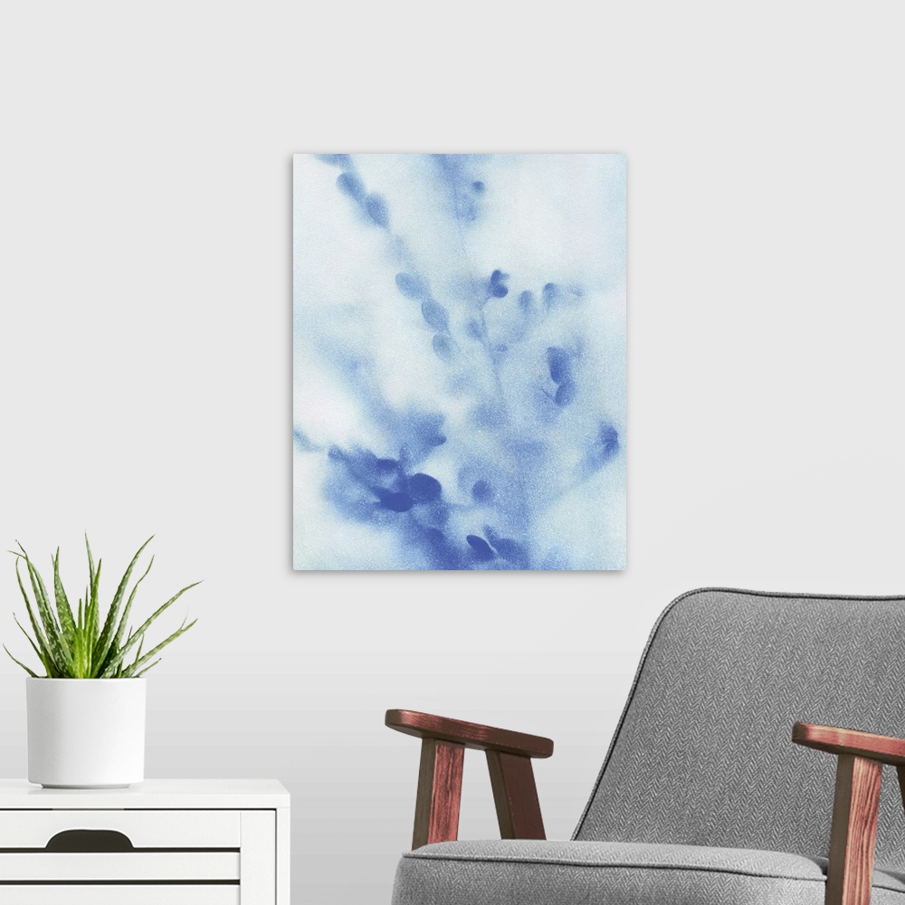 A modern room featuring Abstract painting of wildflowers with a misty look in blue and white.