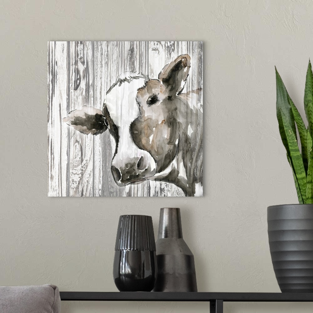 A modern room featuring Decorative artwork of a cow with a rustic wood backdrop.