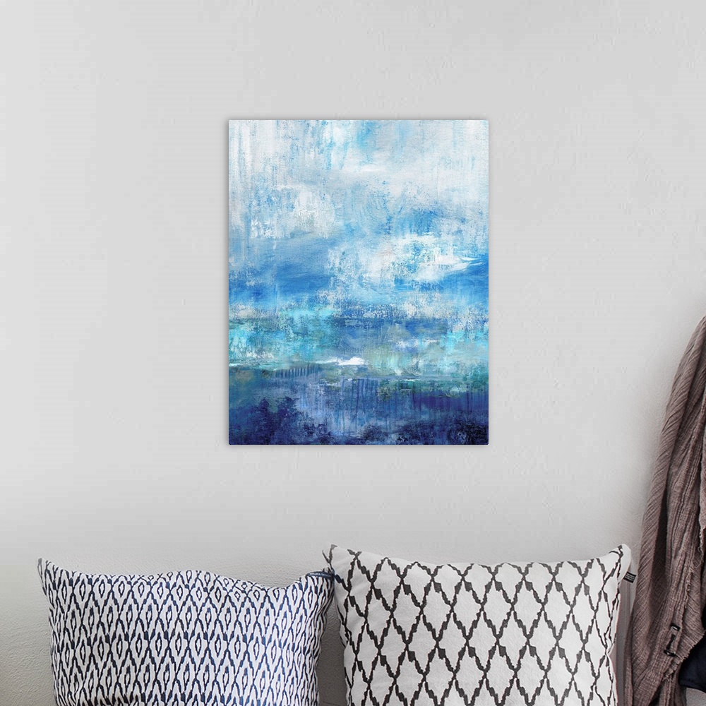 A bohemian room featuring Abstract painting with different shades of blue and a white overlay resembling mist.